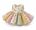 Finished sleeveless patchwork dress with floral bodice and gathered skirt, shown as a sewing example
