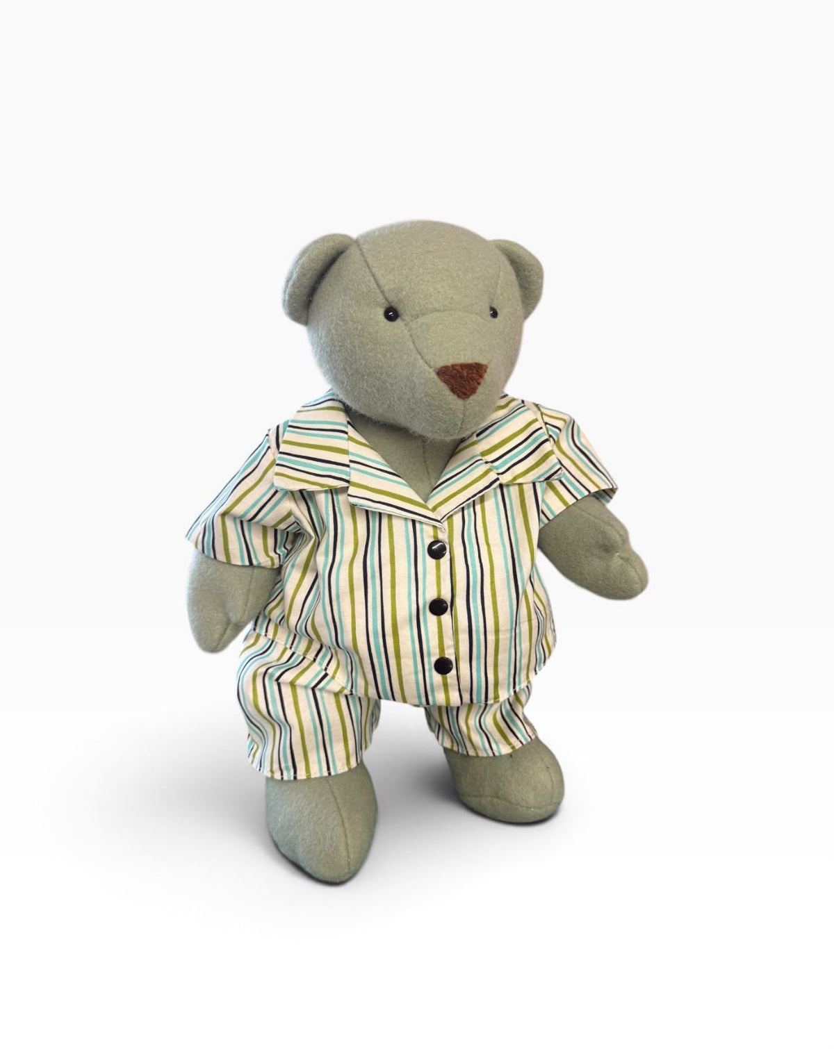 Bear wearing a striped shirt and shorts, shown as a finished sewing example