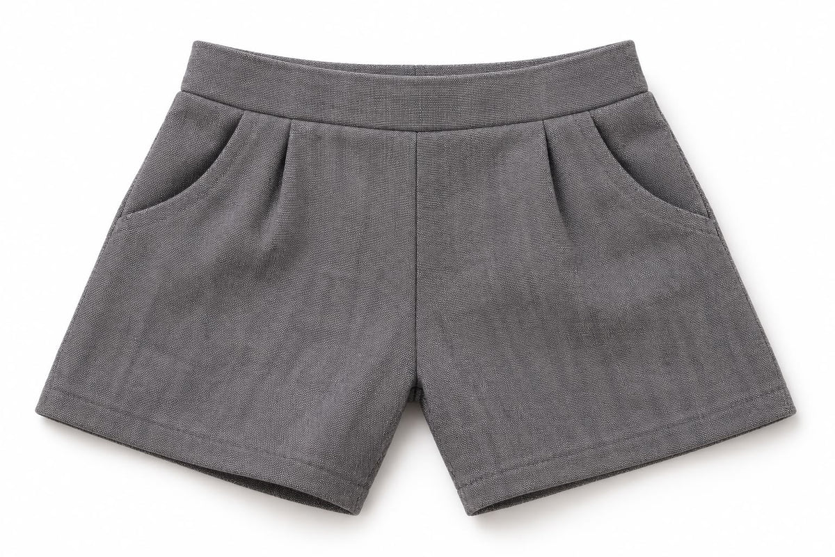 Finished grey trousers with waistband and pockets, shown as a sewing example