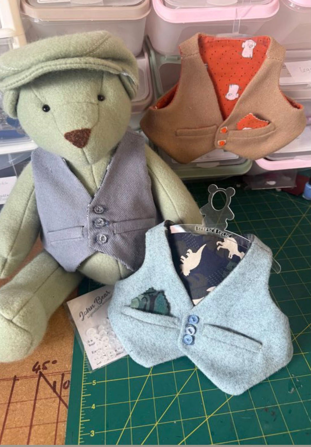 Bear wearing a waistcoat alongside other finished waistcoat examples
